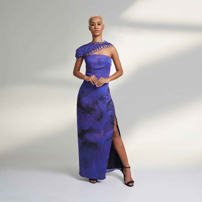 Front view of the long purple tie-dye dress with a one-shoulder lattice trim and side slit