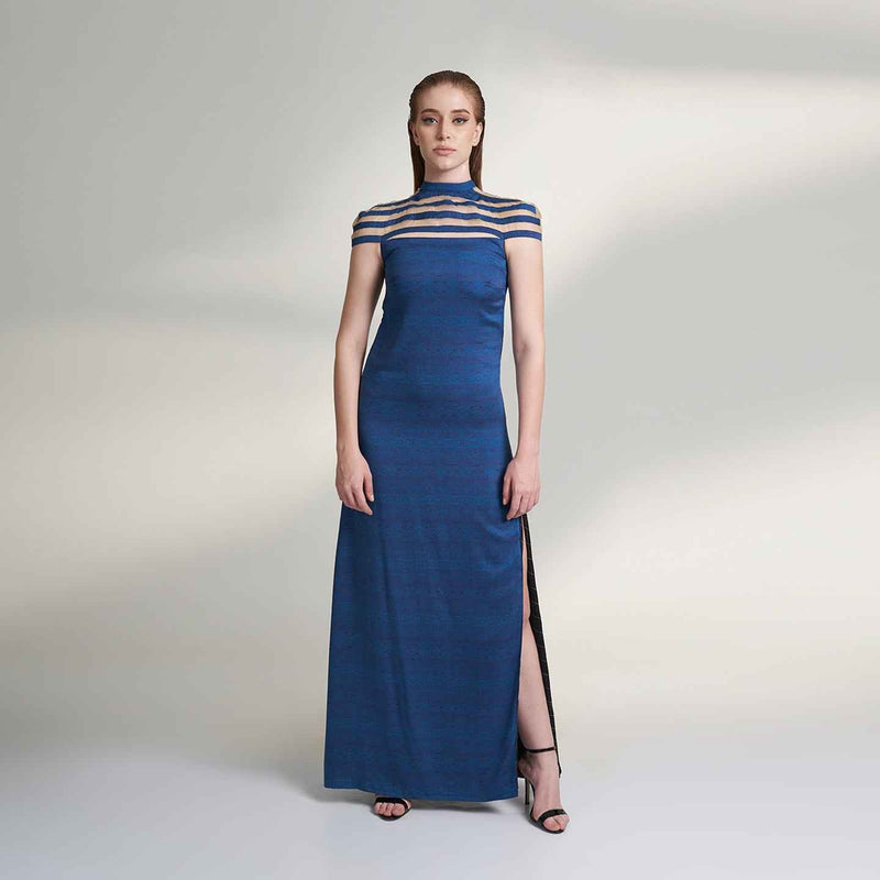 Front view of the long navy blue dress with a sheer striped neckline and side slit