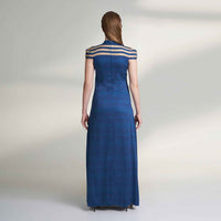 Back view of the long navy blue dress with a sheer striped yoke