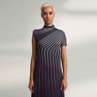 Close-up front view of the black pinstripe dress showing the curved stripe pattern detail