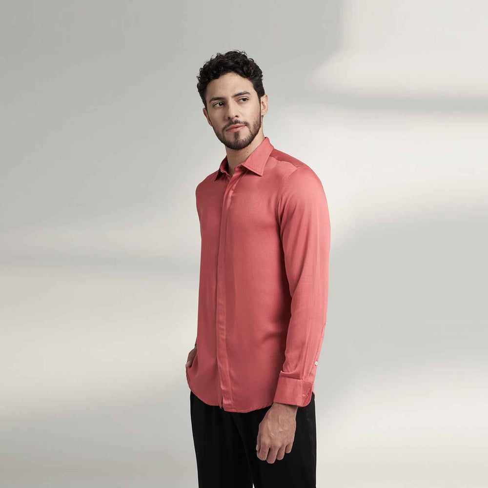 Angled front view of the solid crimson red shirt styled with black trousers