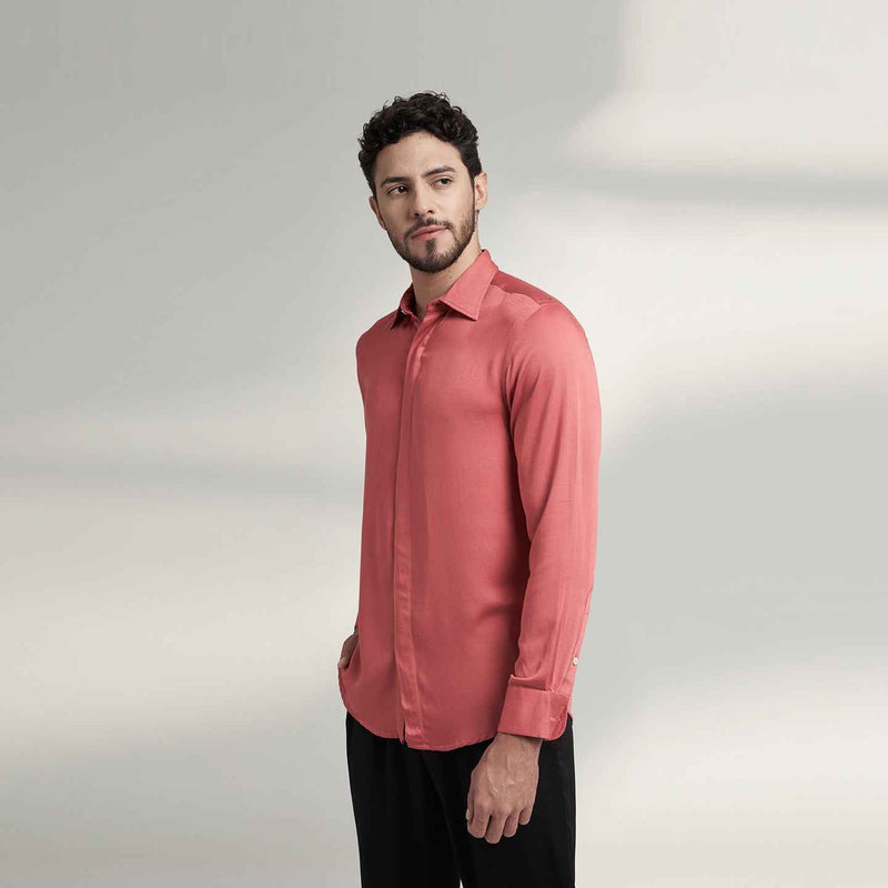 Angled front view of the solid crimson red shirt styled with black trousers