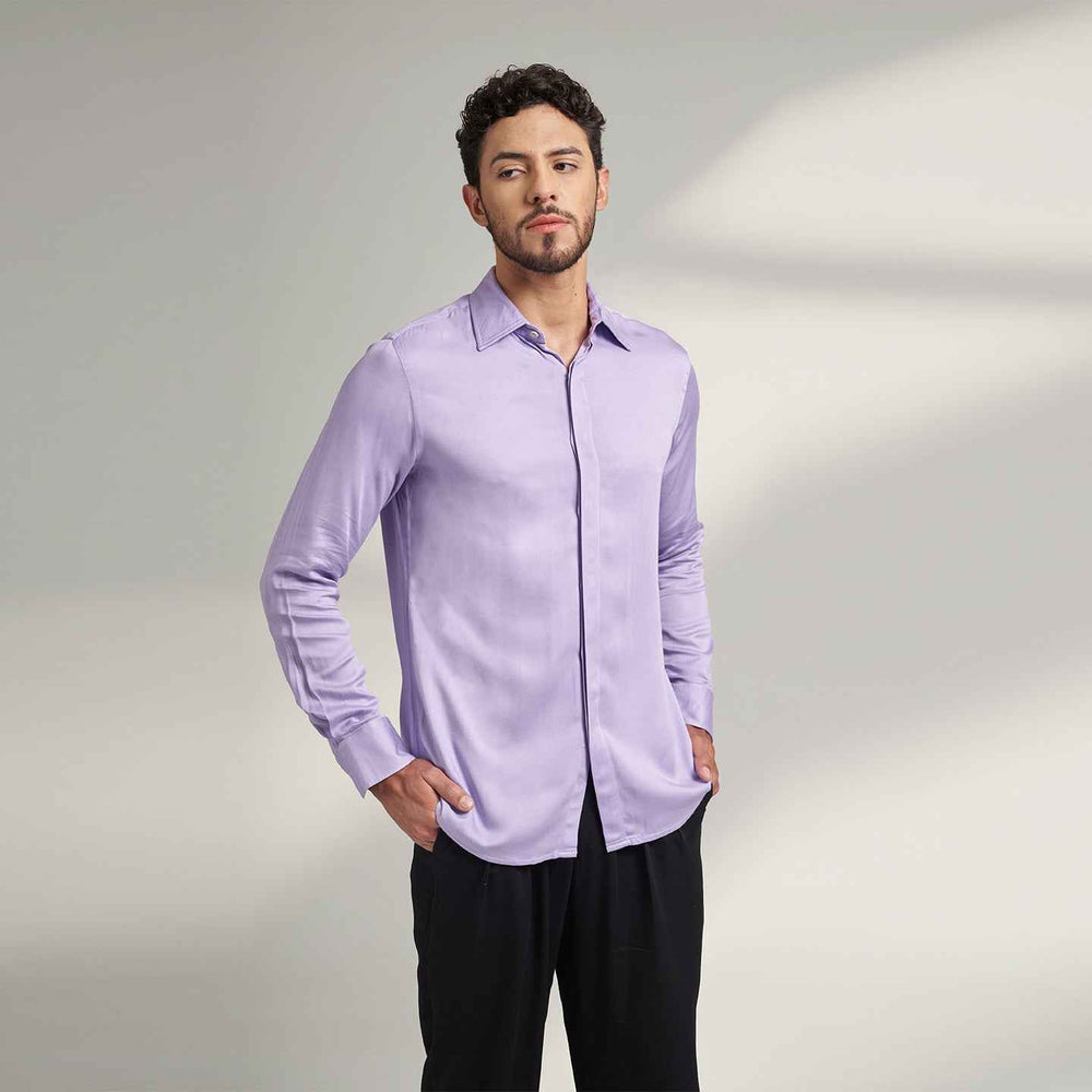 Angled front view of the solid lilac purple shirt styled with black trousers