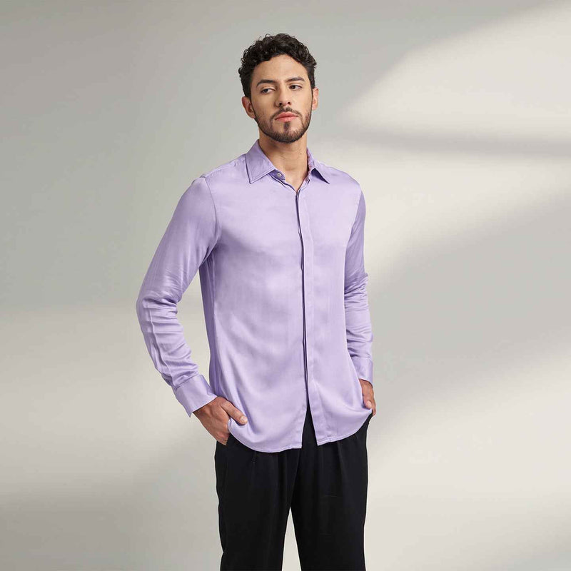 Angled front view of the solid lilac purple shirt styled with black trousers