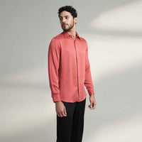 Side view of the solid crimson red shirt with black trousers