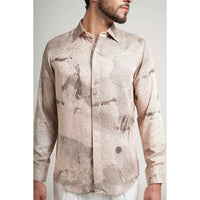 Close-up front view of the blush pink speckled abstract print shirt fabric