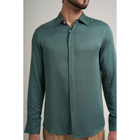 Close-up front view of the solid sage green shirt