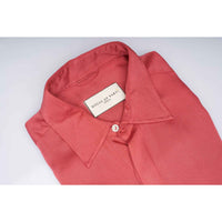 Close-up of the shirt collar showing the House of Parvi label