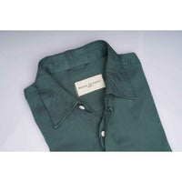 Close-up of the shirt collar showing the House of Parvi label