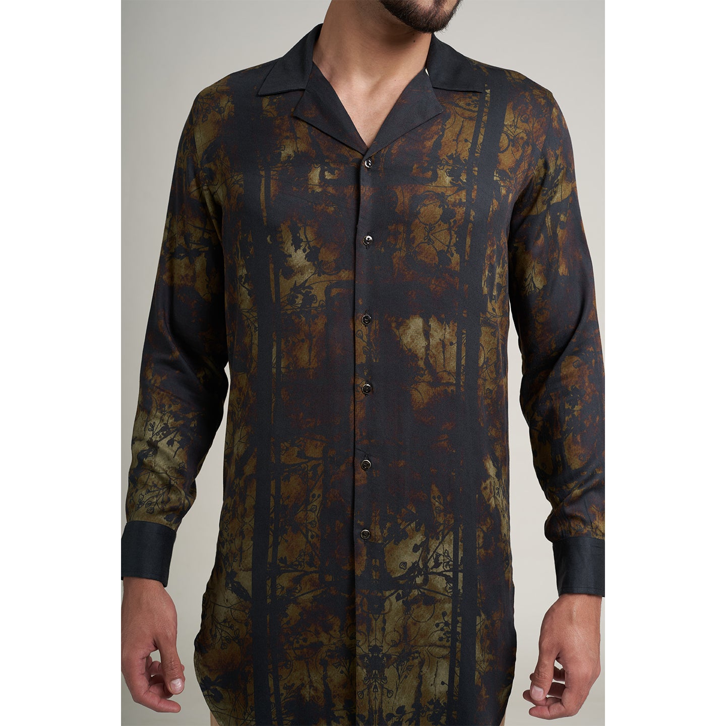 Medium size model wearing Organic Lotus fabric shirt printed with with non toxic GOTS certified inks with subtle black and beige print with cuban collars,the print is inspired from a antique forest painting.