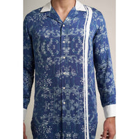 Close-up front view of the blue floral print shirt showing the white contrast trim detail