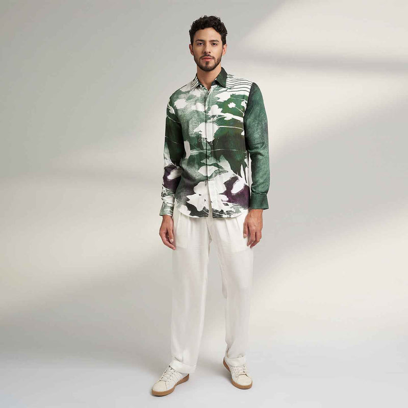 Front view of the sea green and white abstract print shirt and white trousers