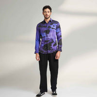 Front view of the purple and black abstract floral print shirt and black trousers