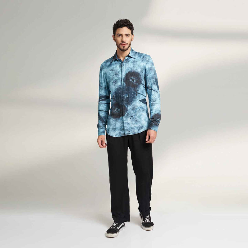 Front view of the blue tie-dye print shirt and black trousers