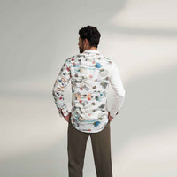 Back view of the white floral print shirt with olive trousers