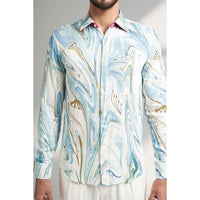 Close-up front view of the blue and white marbled print shirt fabric