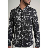 Close-up front view of the black and white leafy line-art print shirt fabric