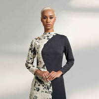 Close-up front view of the colorblock midi dress showing the high neckline and splatter print detail