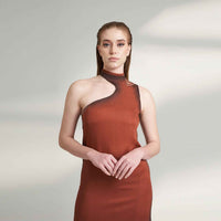Close-up front view of the maroon dress showing the asymmetric shoulder cutout detail