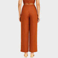 Close-up back view of the burnt orange wide-leg trousers and crop top