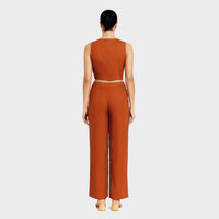Back view of the burnt orange crop top and wide-leg trousers