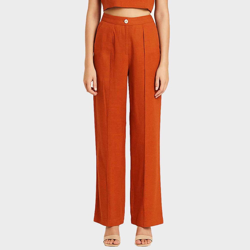 Close-up front view of the burnt orange Lotus Stem Silk wide-leg trousers