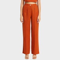 Close-up front view of the burnt orange Lotus Stem Silk wide-leg trousers
