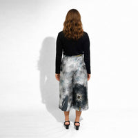 Back view of the abstract grey and black print culottes with a black top
